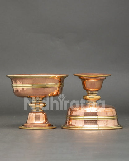Close up engraved small two butter lamps copper handcrafted Tibetan ritual set