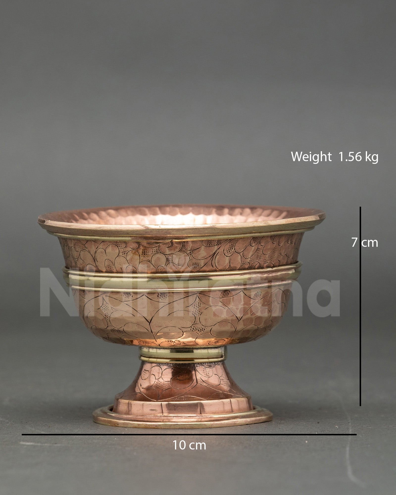 Close up engraved water offering bowl copper handcrafted Tibetan ritual set