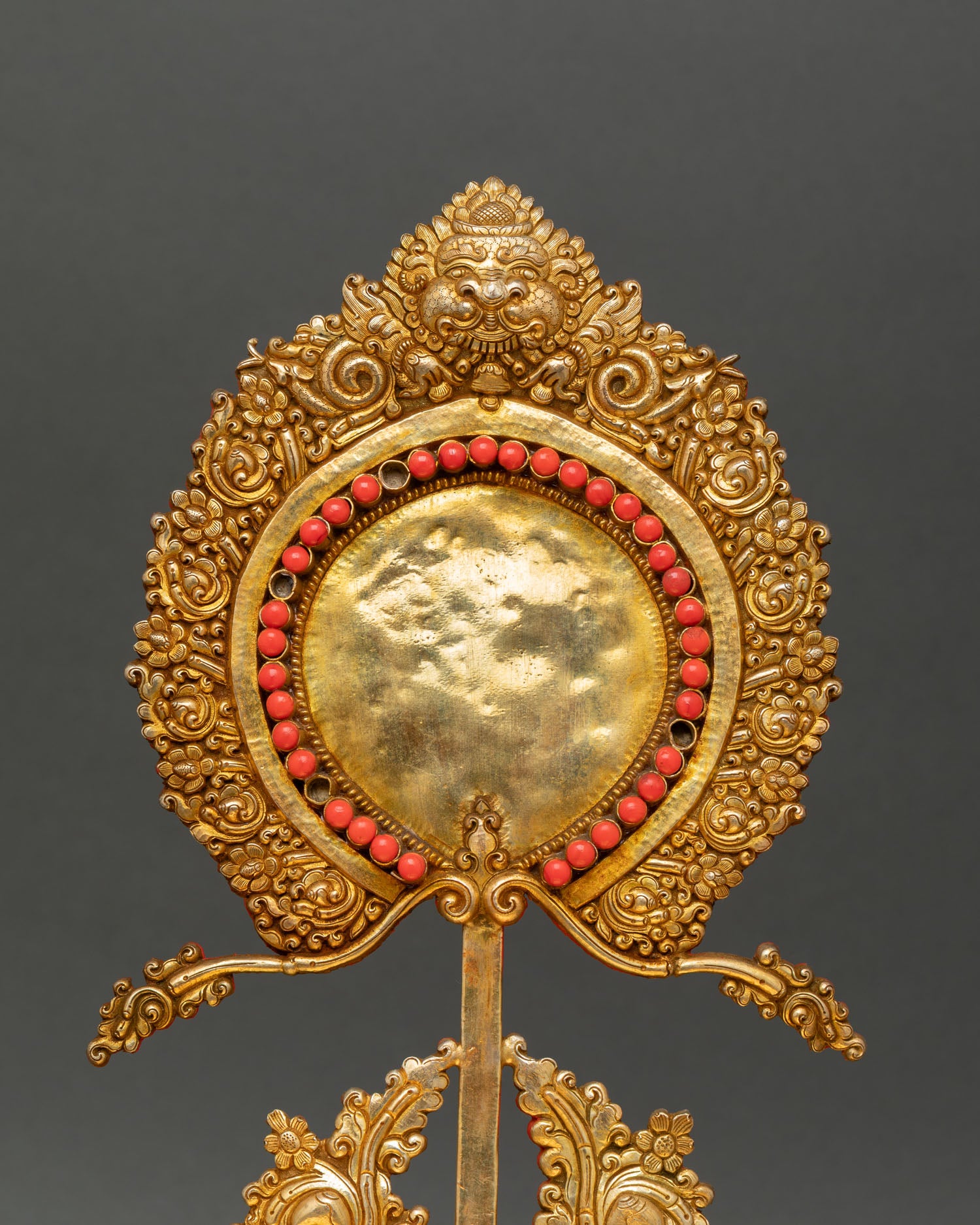 Close up gold gilded copper throne with semi precious stones Himalayan craftsmanship