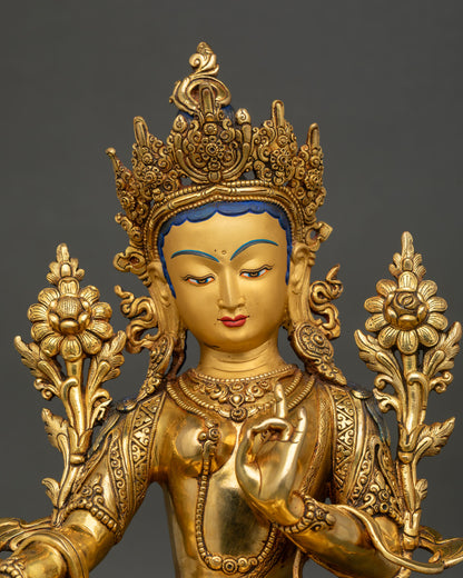 close up green tara droljang statue showing intricate gold gilded details