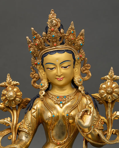 Close up of Green Tara face serene expression gold painted handcrafted Nepal