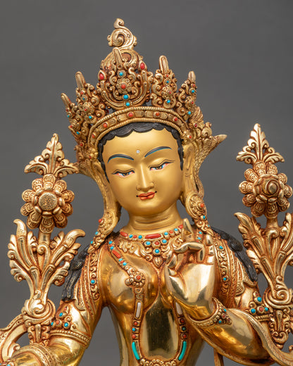 Close up Green Tara gold painted face, turquoise, coral stones, utpala flower