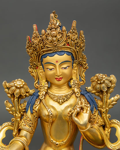 Close up Green Tara statue serene face hand painted copper gold