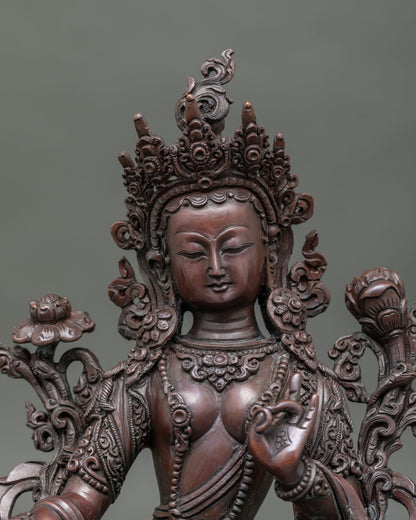 Close-up Green Tara statue showing intricate oxidized copper details and traditional Nepalese craftsmanship