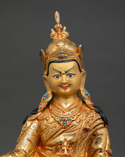 Close up Guru Padmasambhava gold painted face detail Himalayan Buddhist sculpture with ornate crown, sacred Newari craftsmanship
