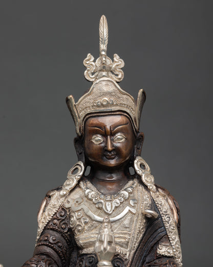 Close up Guru Rinpoche face detailed carving Newari artisan craftsmanship, Buddhist deity 
sacred expression silver plated ornaments