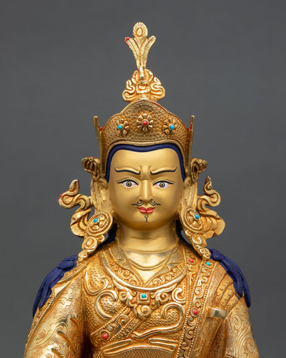 Close up Guru Rinpoche face with gold painted expression serene wisdom and Himalayan Newari artistry detail