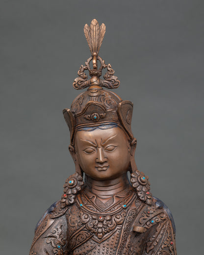 Close up Guru Rinpoche sacred figure hand-carved robes spiritual guidance blessings meditation decor