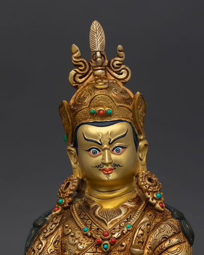Close up Guru Rinpoche statue gold face detailed lotus hat feather crown, Buddhist craftsmanship Nepal