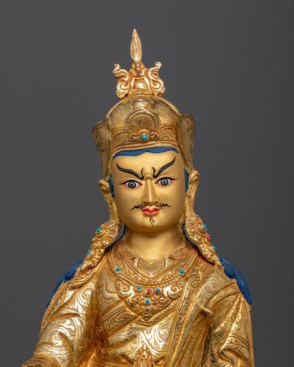 Close Up Guru Rinpoche Statue with Gold-Painted Face and Semi-Wrathful Expression