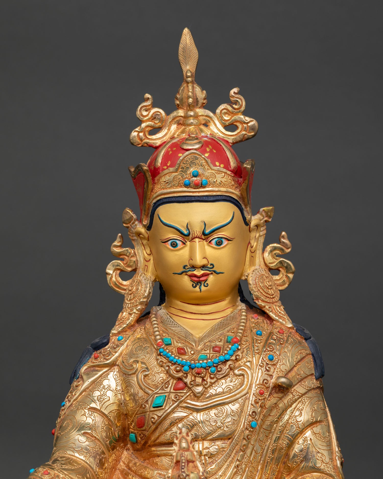 close up guru rinpoche statue intricate copper details 24k gold gilding nepal handcrafted sculpture