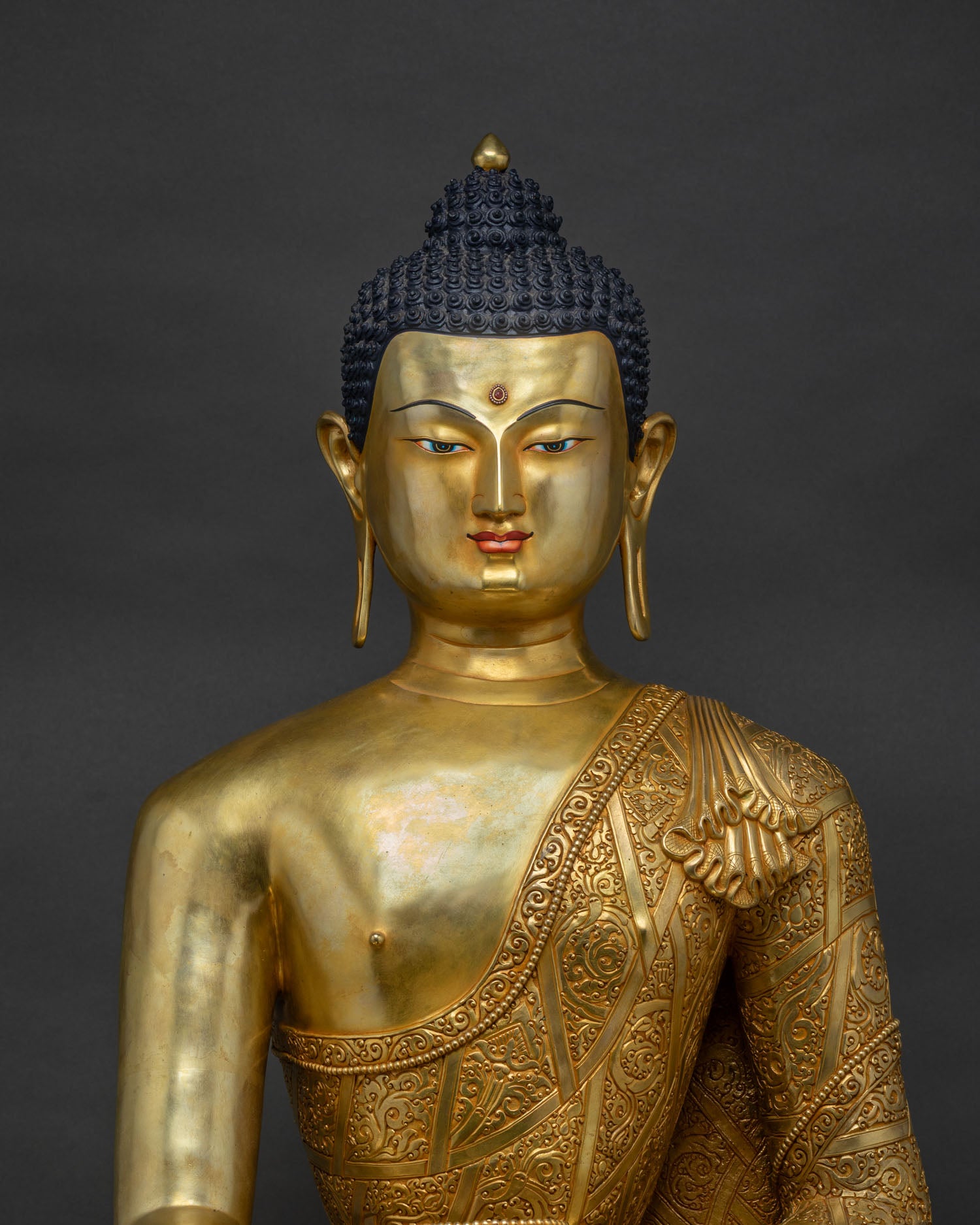 Close-Up of Hand-Chased Repoussé Robe on Gold Fire-Gilded Buddha Statue