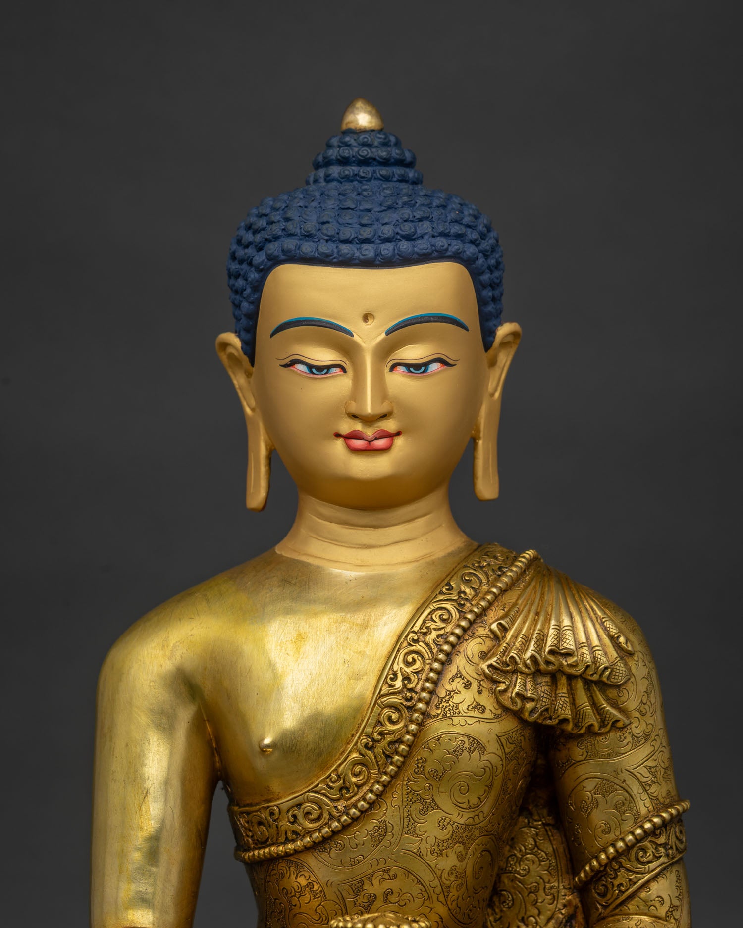 Close up view of handcrafted Shakyamuni Buddha statue in Bhumisparsha Mudra on lotus throne