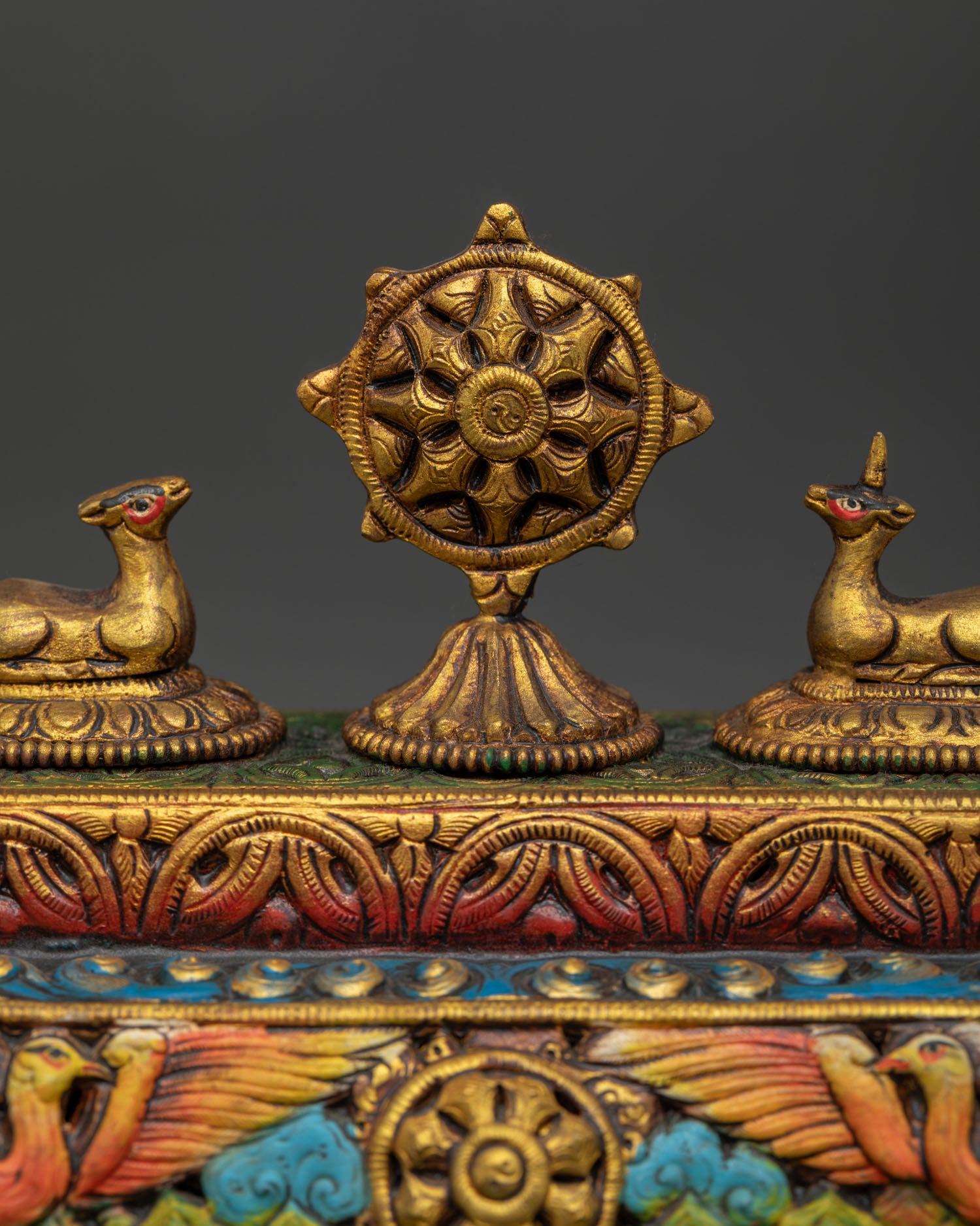 Close up incense burner gold gilded surface with acrylic painting and carvings