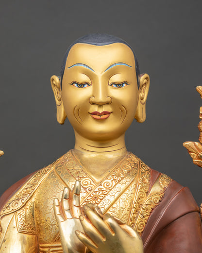 Close up Je Tsongkhapa face detail radiant 24K gold painted expression Himalayan Buddhist art Newari craftsmanship sacred Gelug lineage statue