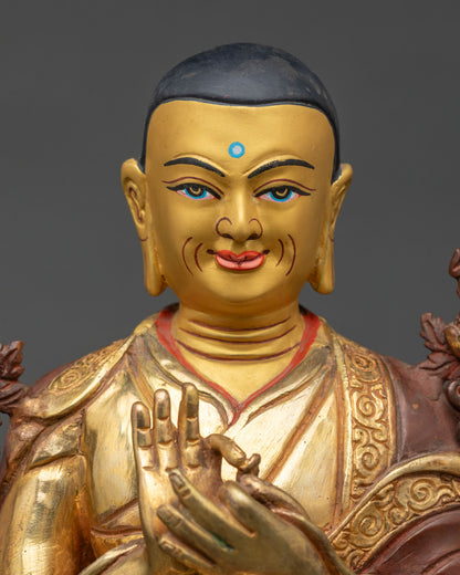 Close up Je Tsongkhapa statue hand painted details Dharmachakra Mudra