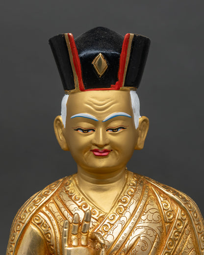 Close-up Karmapa face with gold-painted finish and intricate crown details
