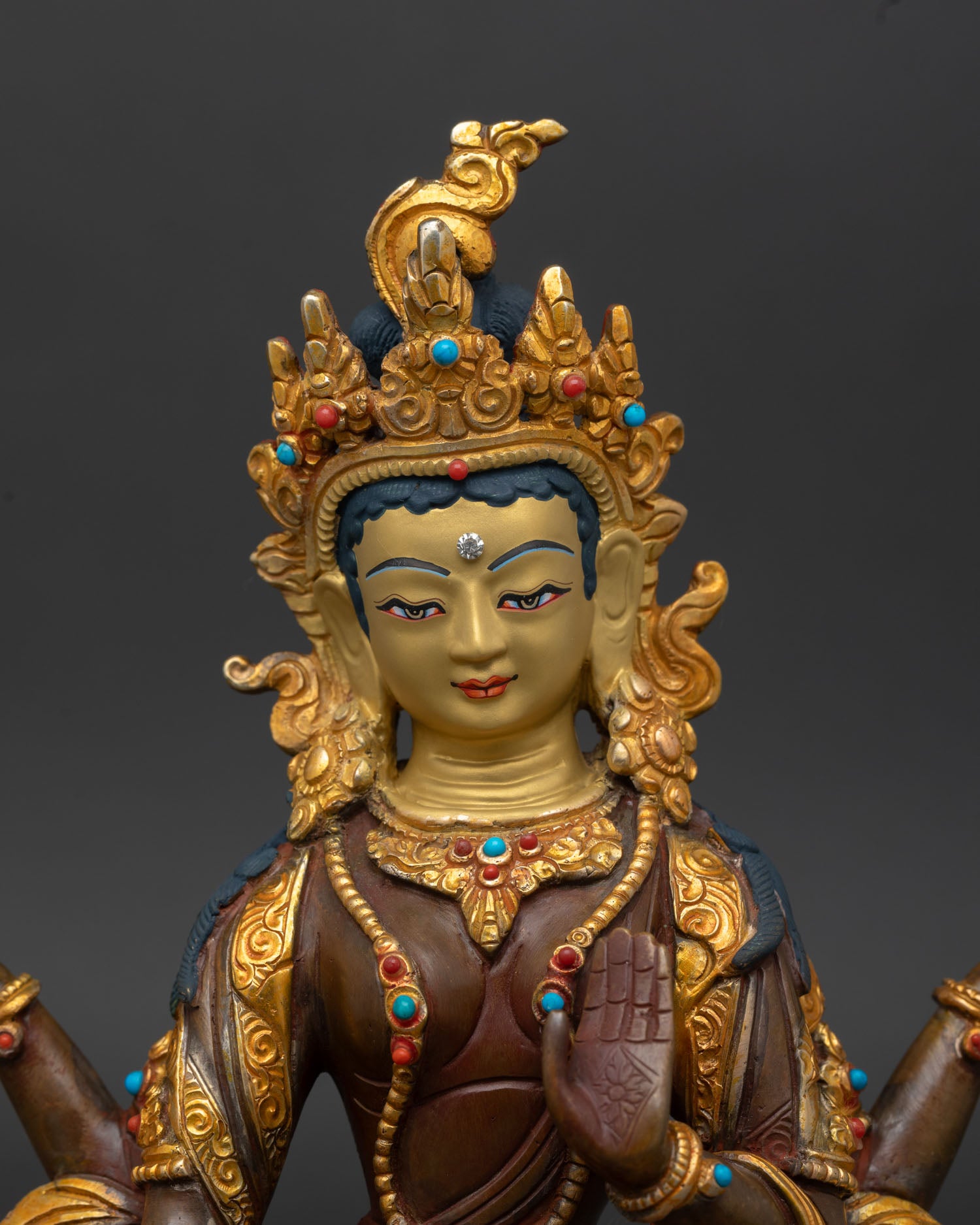 Close up Laxmi goddess statue showing four arms lotus flower pot of gold varada mudra and intricate Newari artisan craftsmanship from Nepal