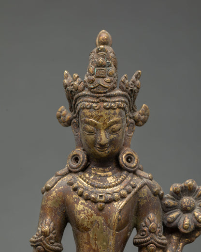 Close up Lokeshvara face detail Padmapani statue gold gilded copper Himalayan art Newari craftsmanship Buddhist compassion deity tribhanga posture