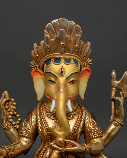close up lord ganesha face detail majestic crown gold painted expression wisdom prosperity remover of obstacles hindu god statue