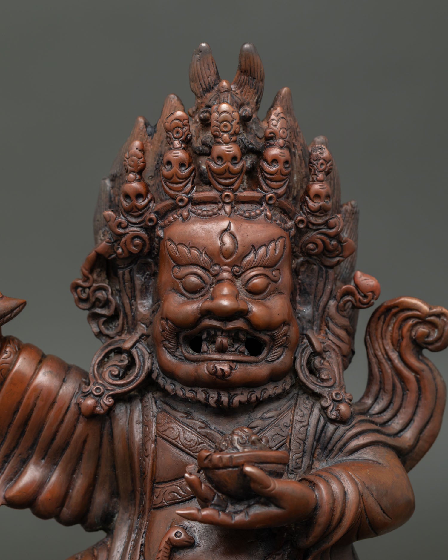 Close up Mahakala Bernagchen face showing wrathful expression and Newari craftsmanship.