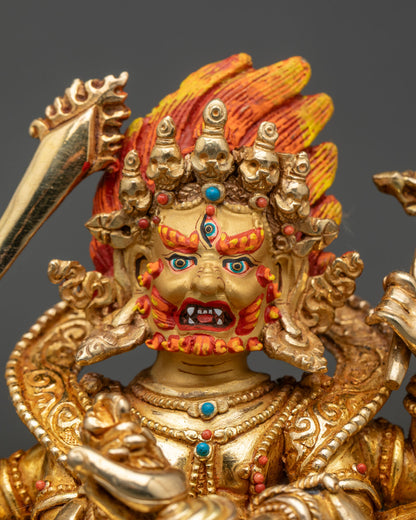 Close Up Mahakala Face Blazing Eyes Bared Fangs Gold Painted Expression Detail