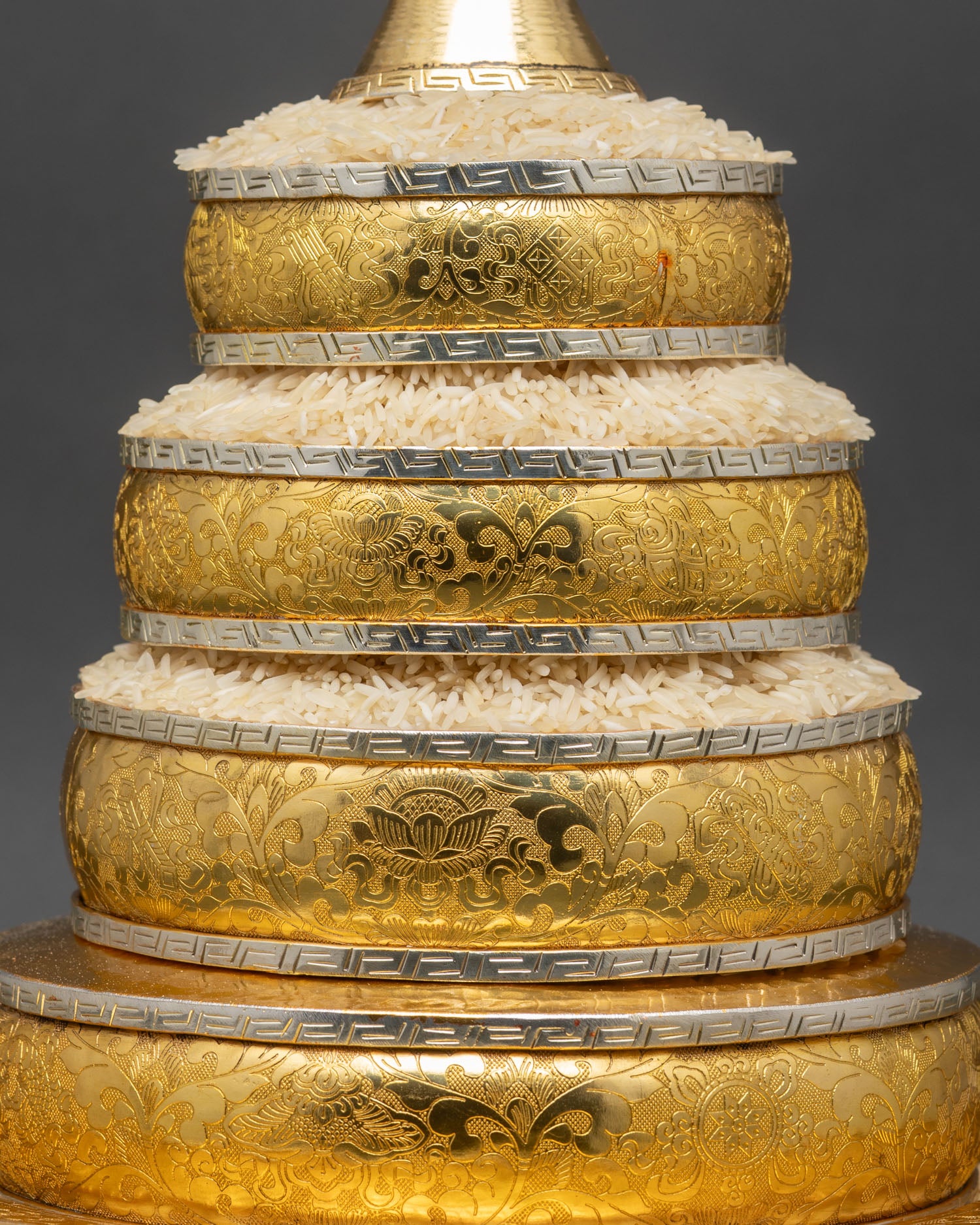 Close up mandala offering set intricate concentric rings with grains and jewels