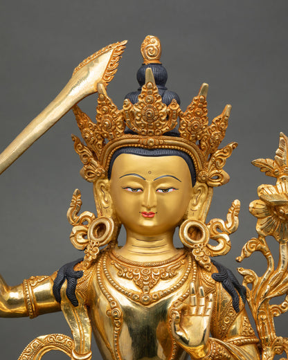Close up Manjushree face with serene gold finish, Newari artisan Buddhist wisdom deity 