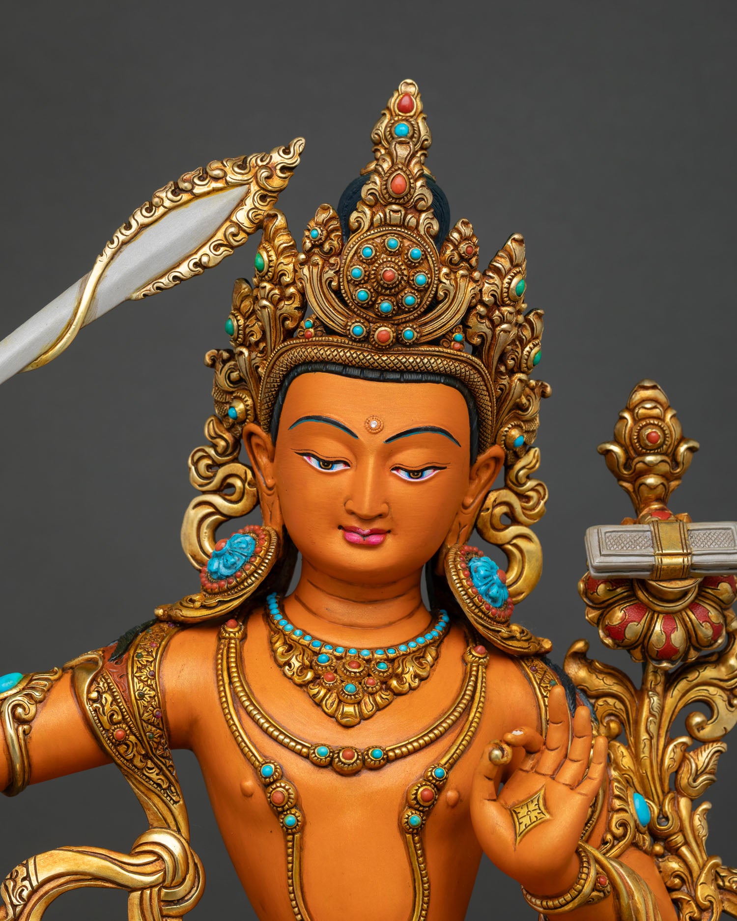 Close up Manjushri face with serene expression detailed crown flowing vestments and intricate Himalayan Buddhist craftsmanship