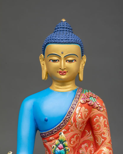 Close up Medicine Buddha statue with gold painted face hand applied acrylic details, Himalayan healing Buddha artwork