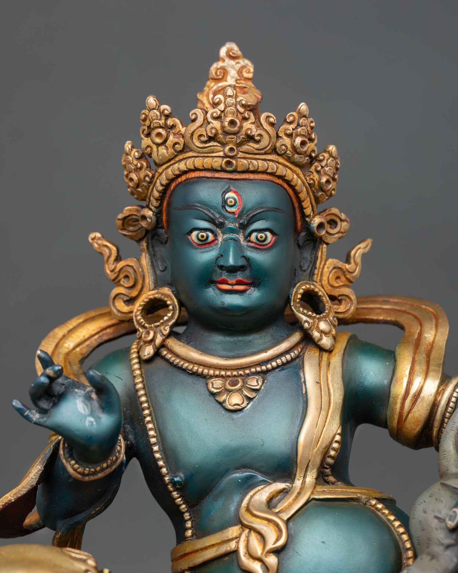 Close up Namtoshe face with serene expression sacred Himalayan Buddhist deity and ornate halo detail