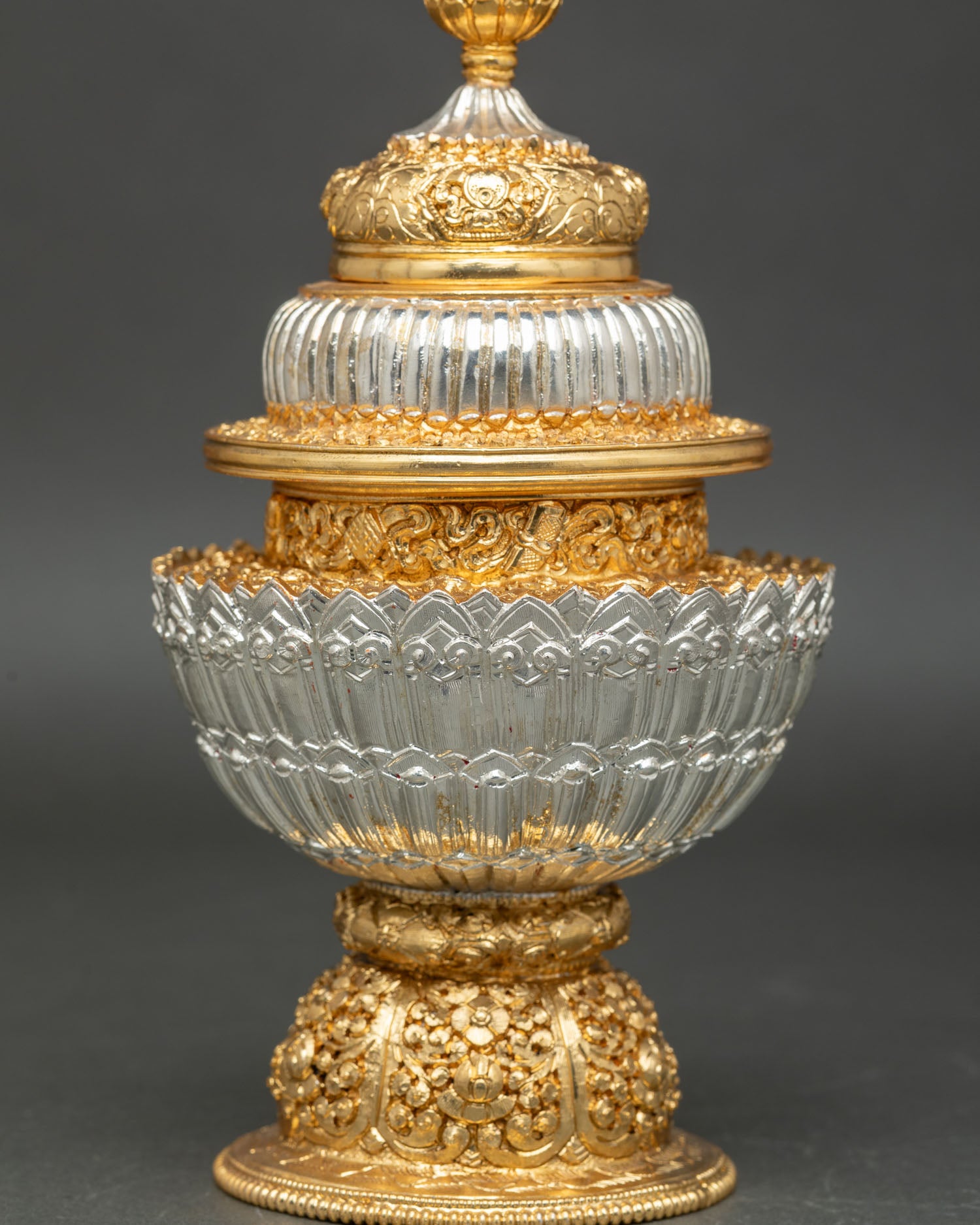 close up neshi rice pot detail floral motifs ornamental carving sacred buddhist altar vessel handcrafted nepal
