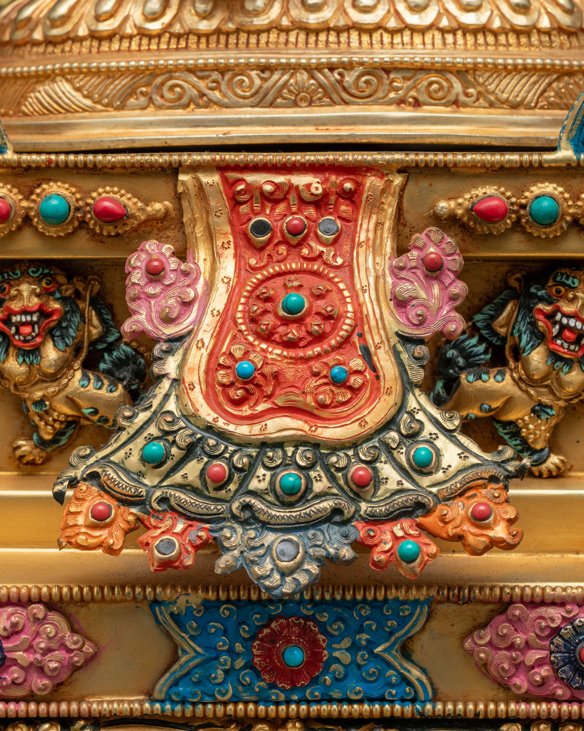 Close-up of 21 Tara Statue Set base with turquoise and coral inlays and snow lions