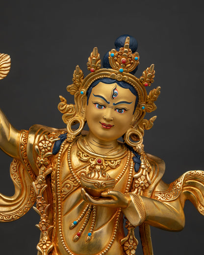 Close-up of Achi Chokyi Drolma's hand-chased mirror and kapala vessel