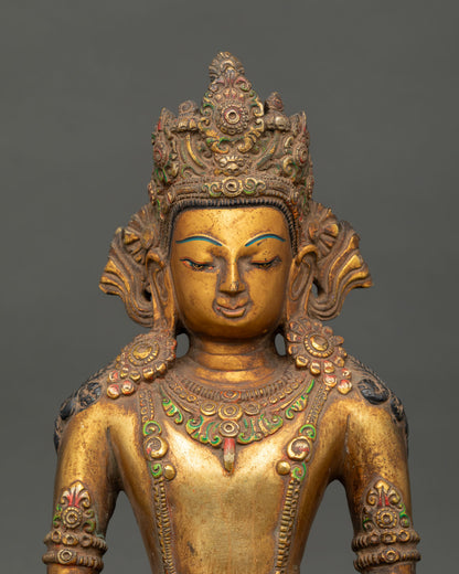 Close up of Amitabha Buddha face showing serene expression and gold gilded features