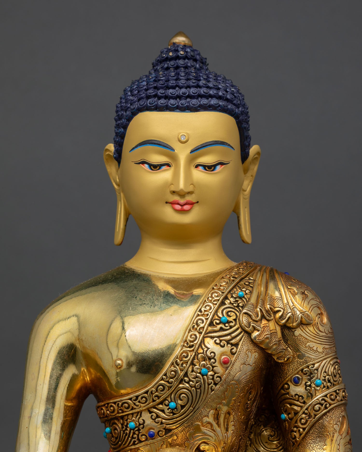 close up of Amitabha Buddha sculpture with gold gilded copper craftsmanship