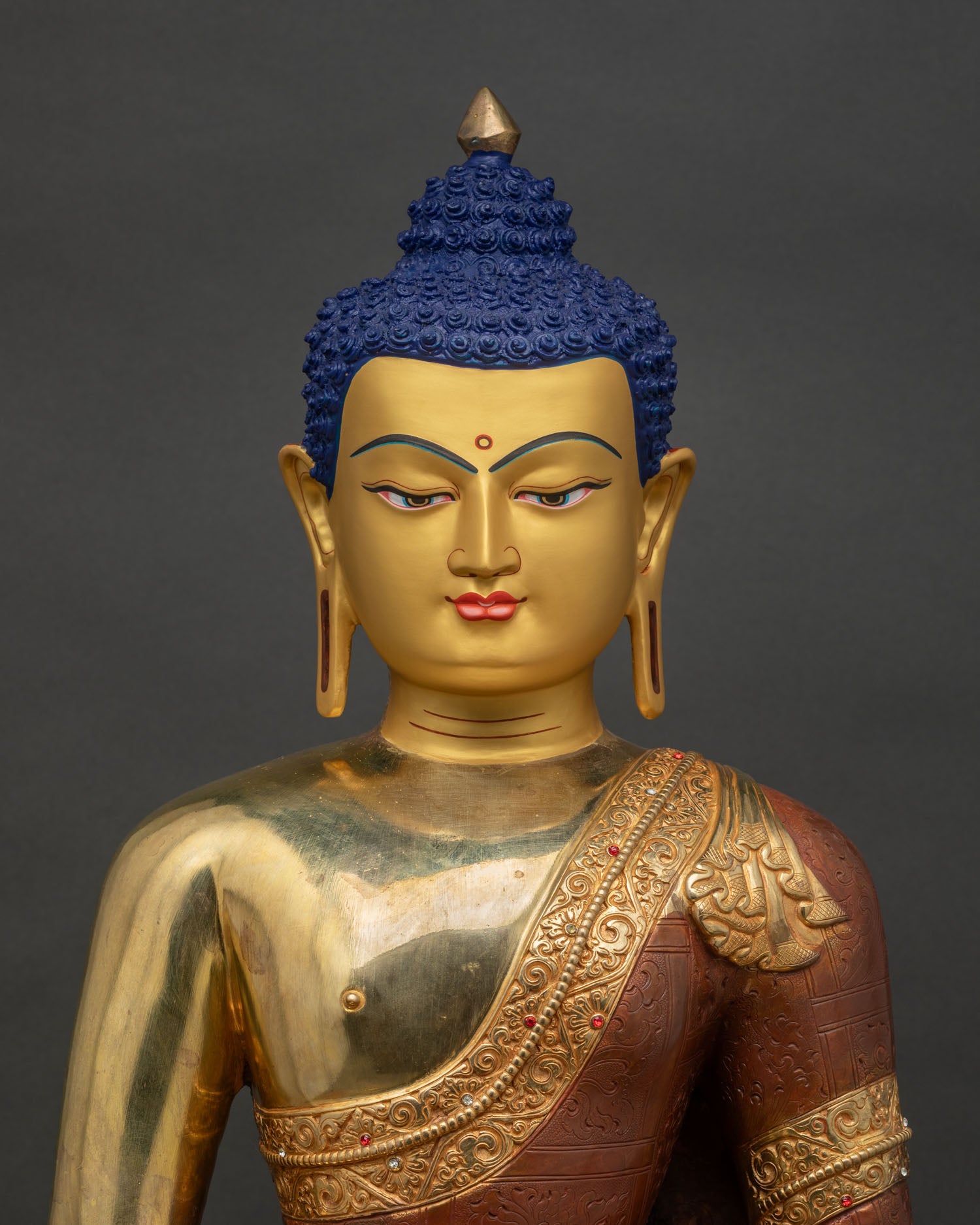 Close-up of Amitabha Buddha Statue showing gold-gilded copper craftsmanship