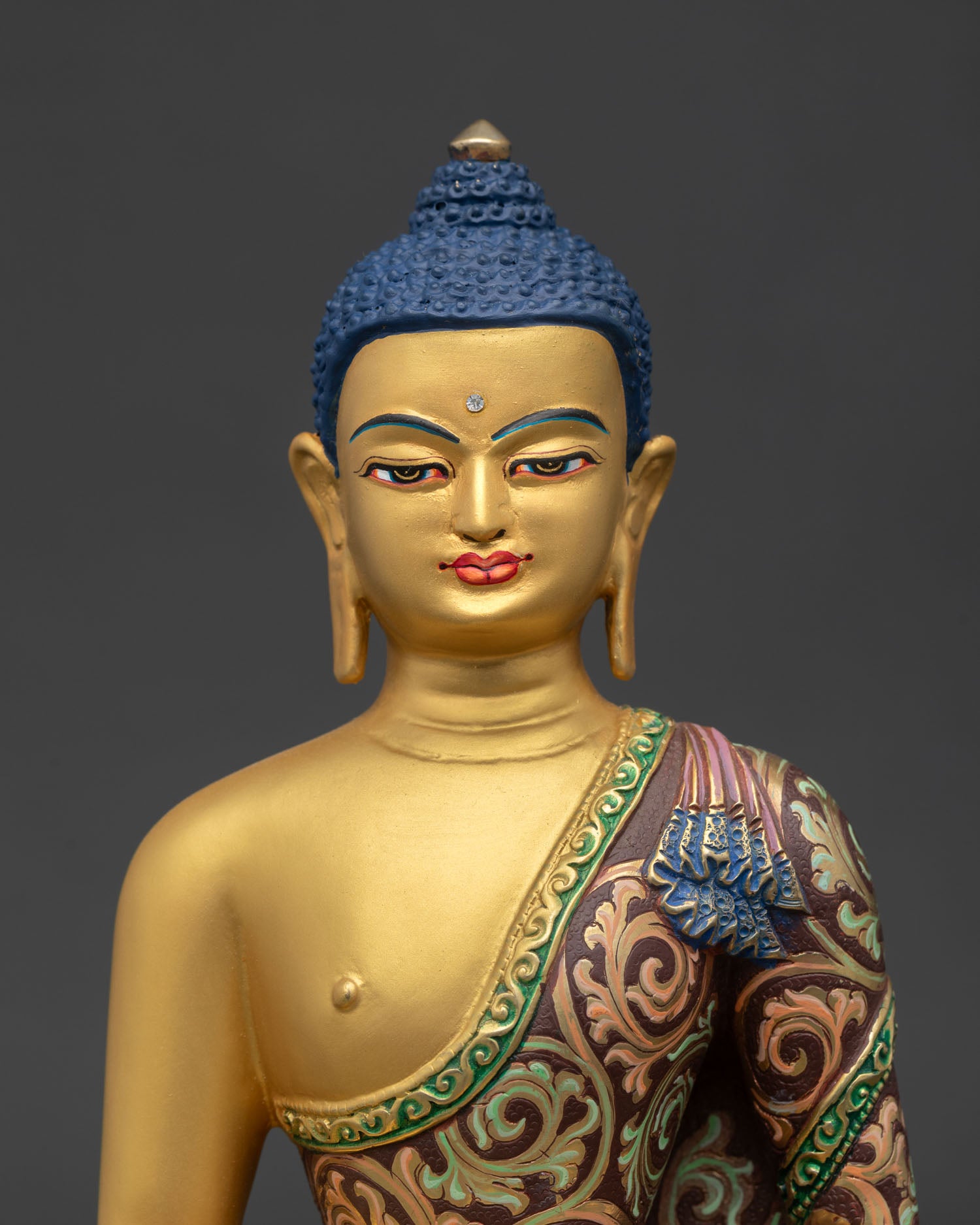 close up of Amitabha Buddha statue with floral robe and lotus seat