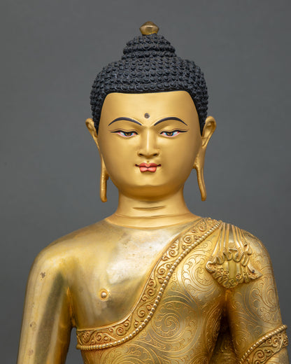 close up of amitabha buddha statue with intricate gold gilded details from nepal