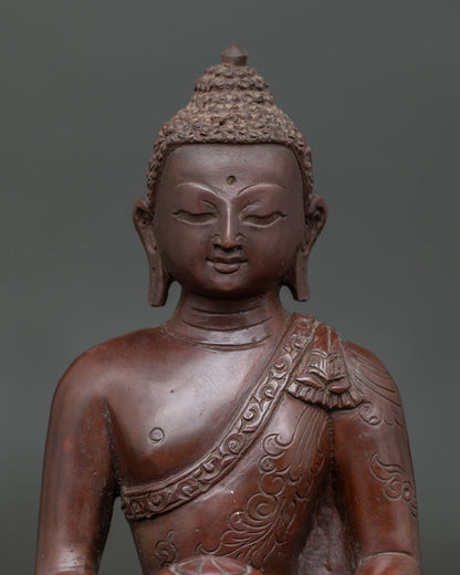 Close-up of Amitabha Buddha Statue with serene expression and hand-carved floral motif silk garment.