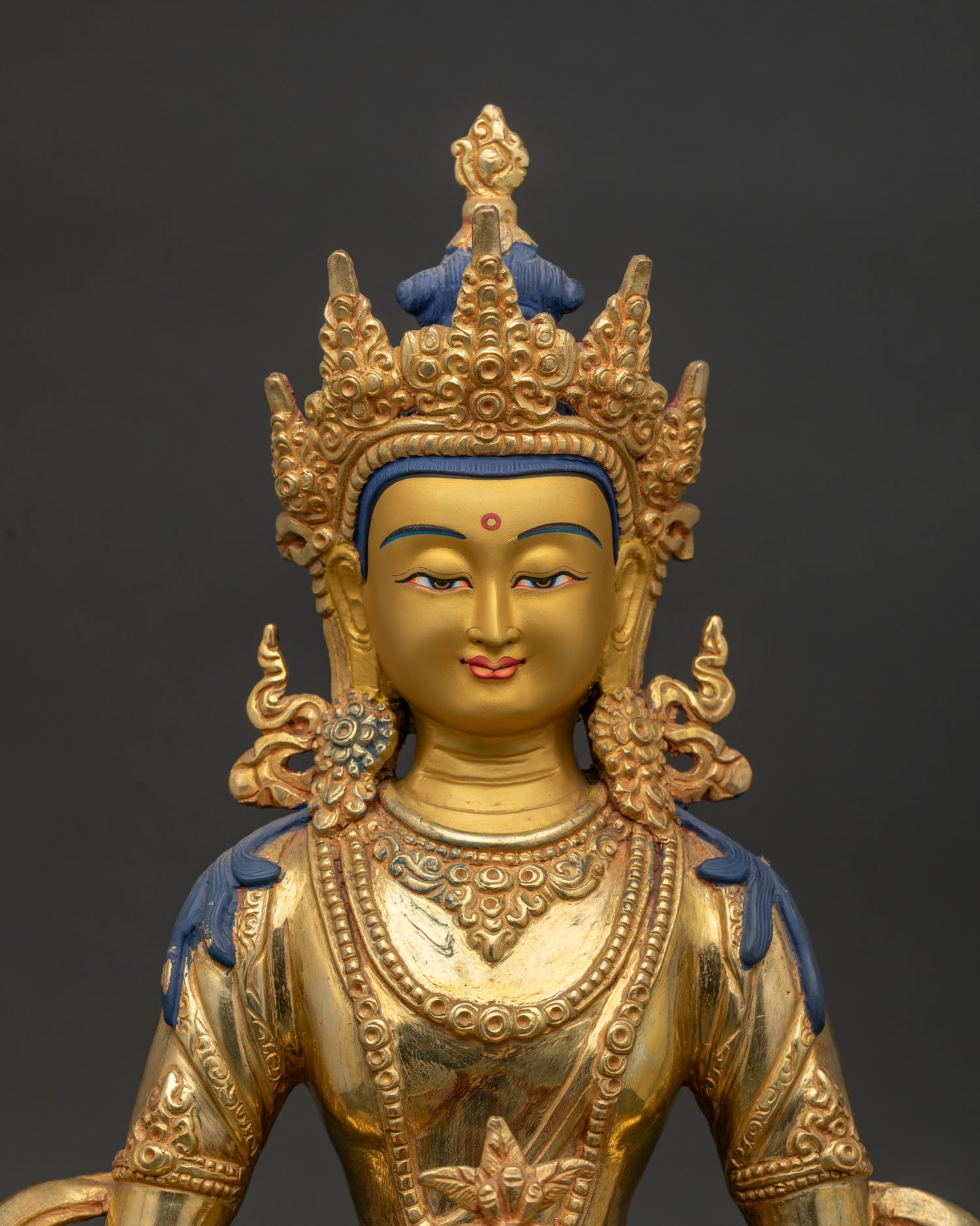 Close up of Amitayus Buddha holding sacred ambrosia vase in Dhyana Mudra.