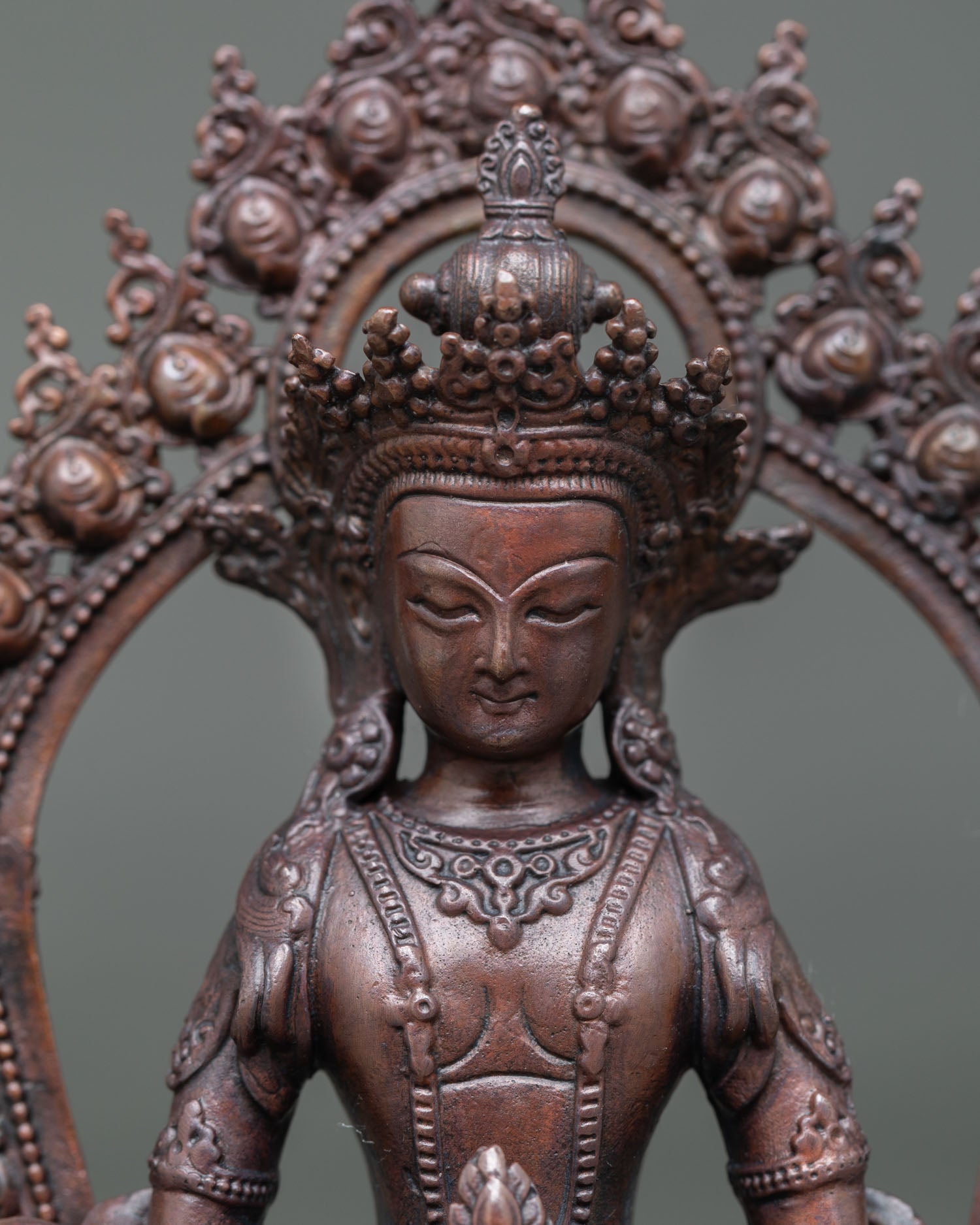 Close-up of Amitayus Statue, detailed oxidized finish