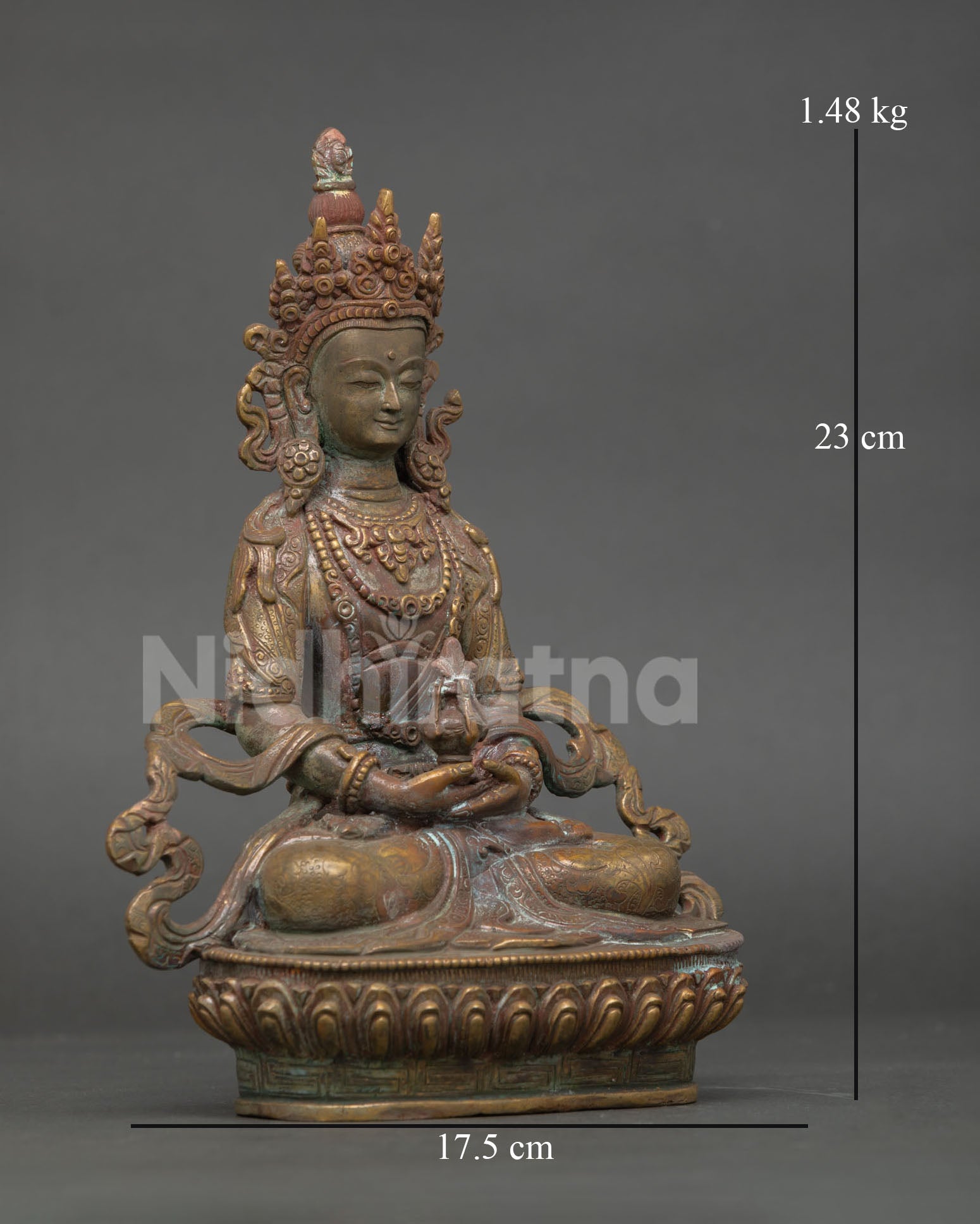 Close-up of Amitayus statue showing oxidized copper details and sacred adornments
