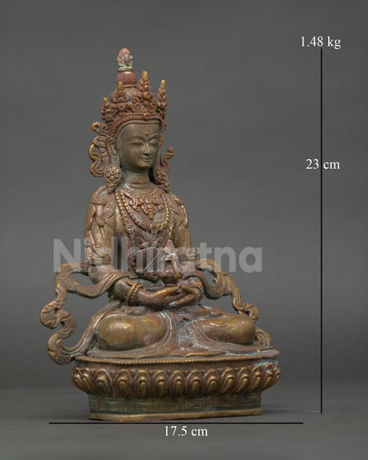 Close-up of Amitayus statue showing oxidized copper details and sacred adornments