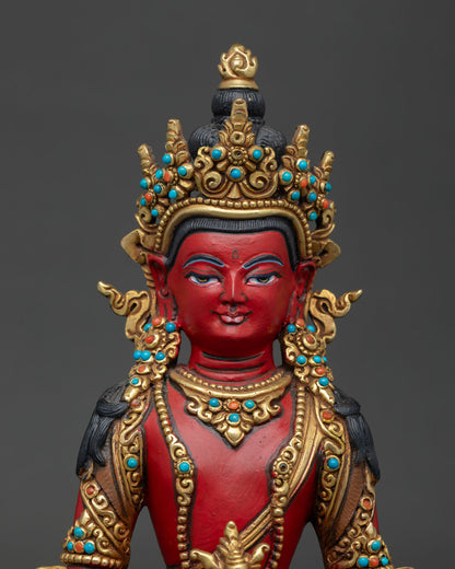Close up of Amitayus Statue showing serene face, rich colors, and traditional artwork