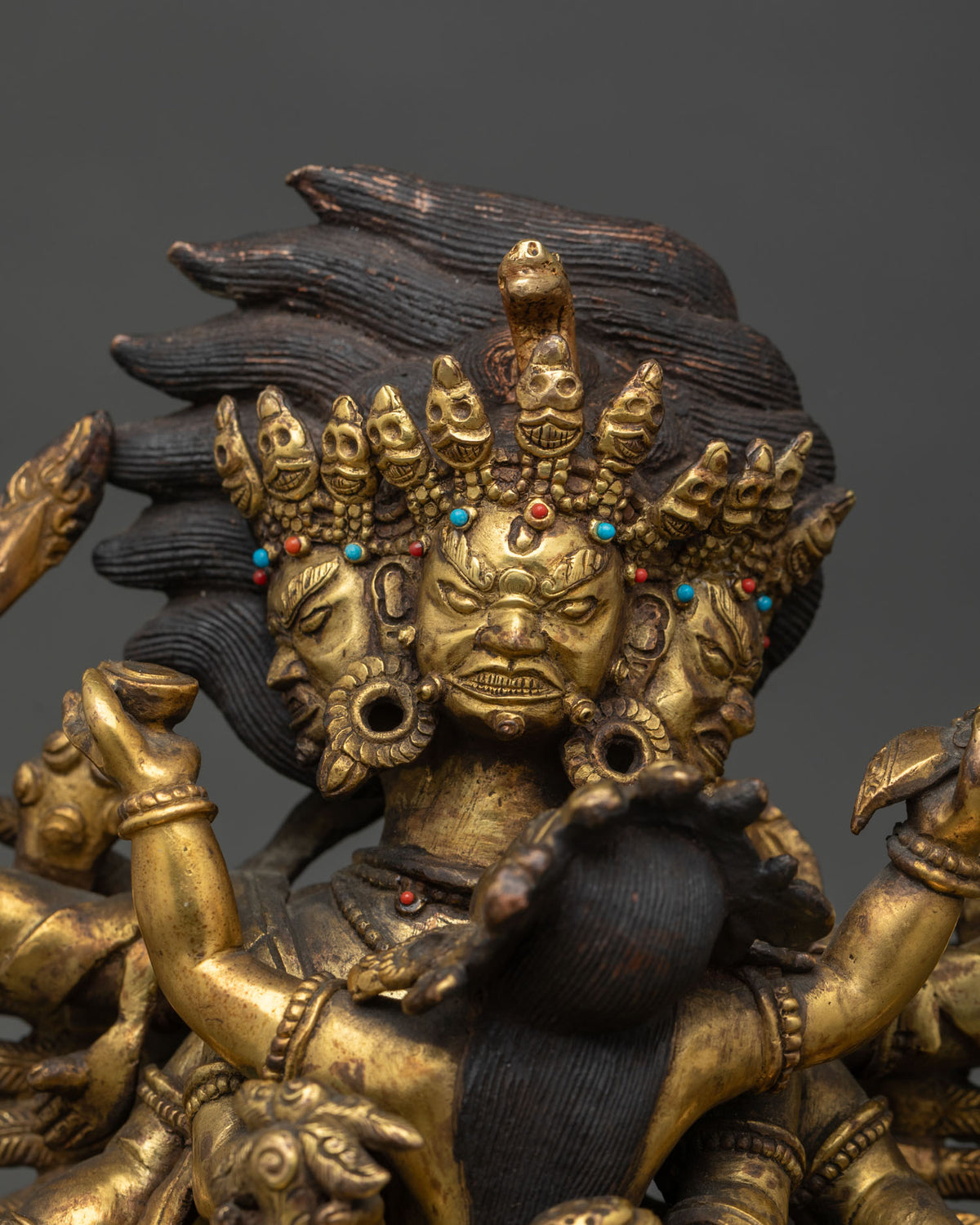 Close up of antique Hayagriva Yab-Yum statue with consort, copper Tibetan Buddhist statue