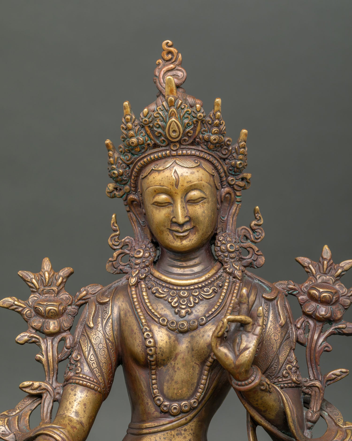 Close-up of antique White Tara statue with handcrafted copper details from Nepal