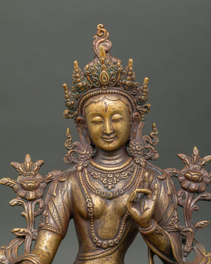 Close-up of antique White Tara statue with handcrafted copper details from Nepal