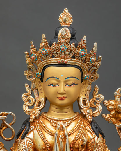 Close-up of Avalokiteshvara Chenrezig statue showing fire-gilded gold and copper craftsmanship