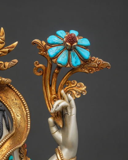Close-up of Avalokiteshvara statue's hand holding gold-gilded turquoise lotus blossom